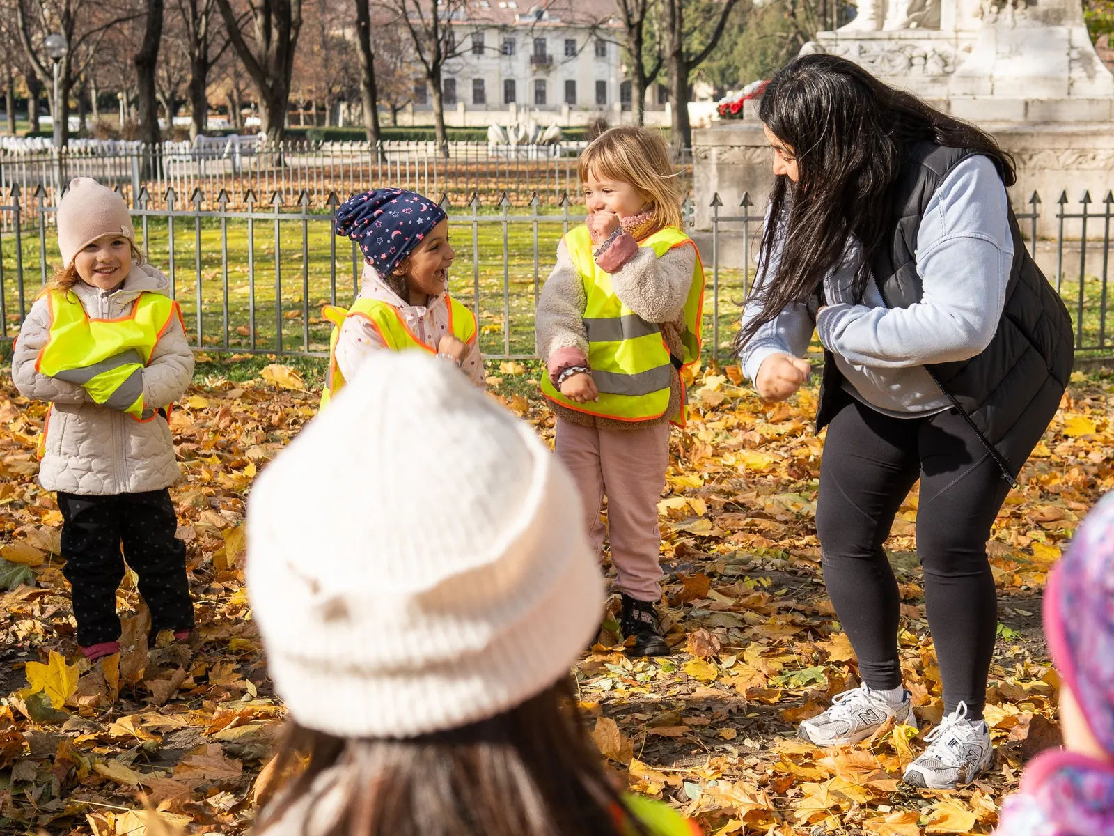 A teacher and children on a fall field trip in the city