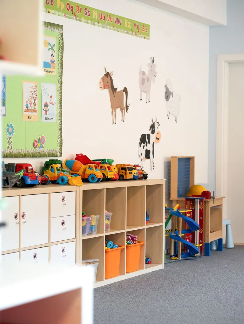 A Handprints classroom with the seasons board and children's artwork